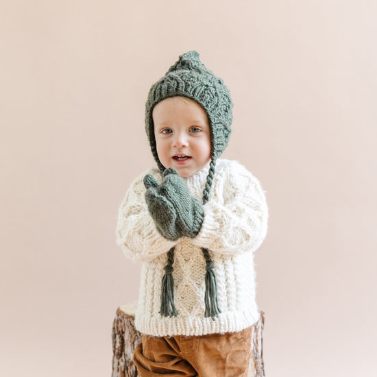 The Blueberry Hill Classic Hand Knit Mittens in Olive model