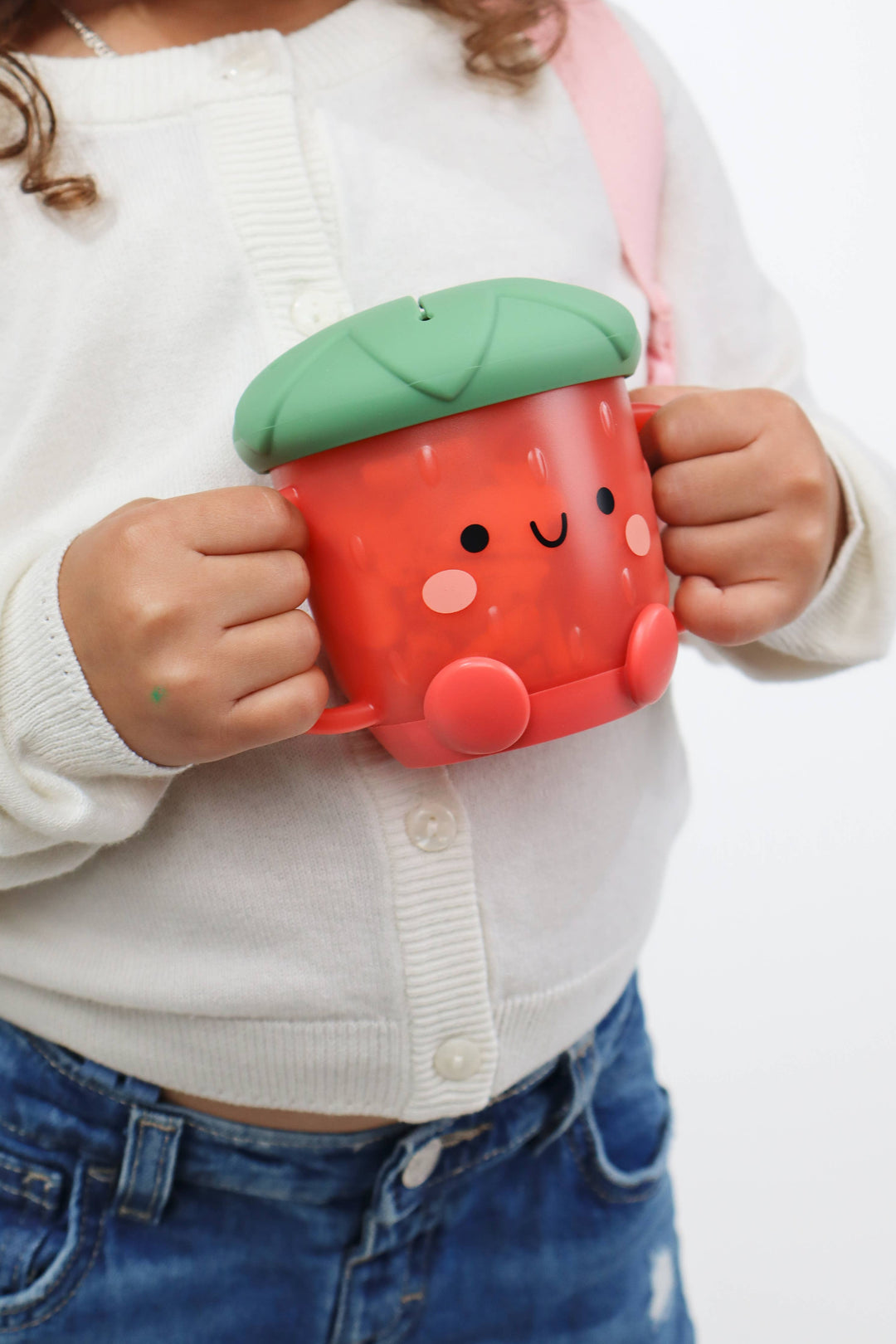 Itzy Ritzy Strawberry Itzy Snack Cup girl holding