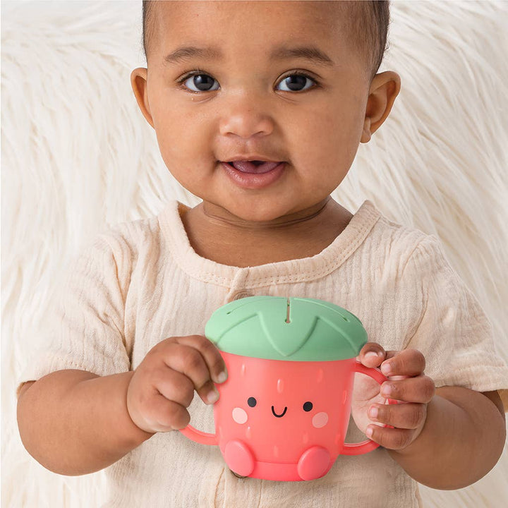 Itzy Ritzy Strawberry Itzy Snack Cup model holding