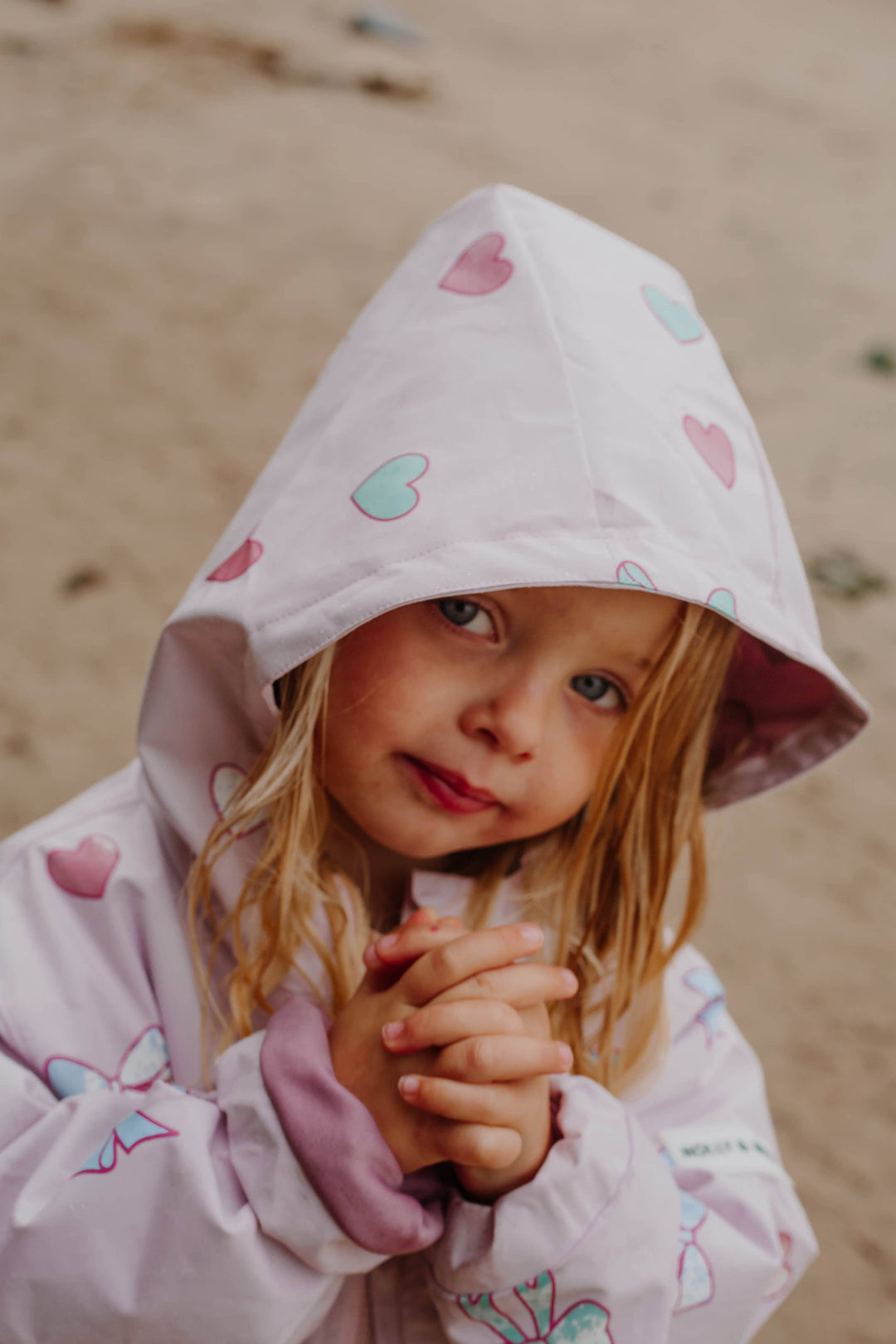 Holly & Beau Hearts & Bows Color Changing Raincoat model face