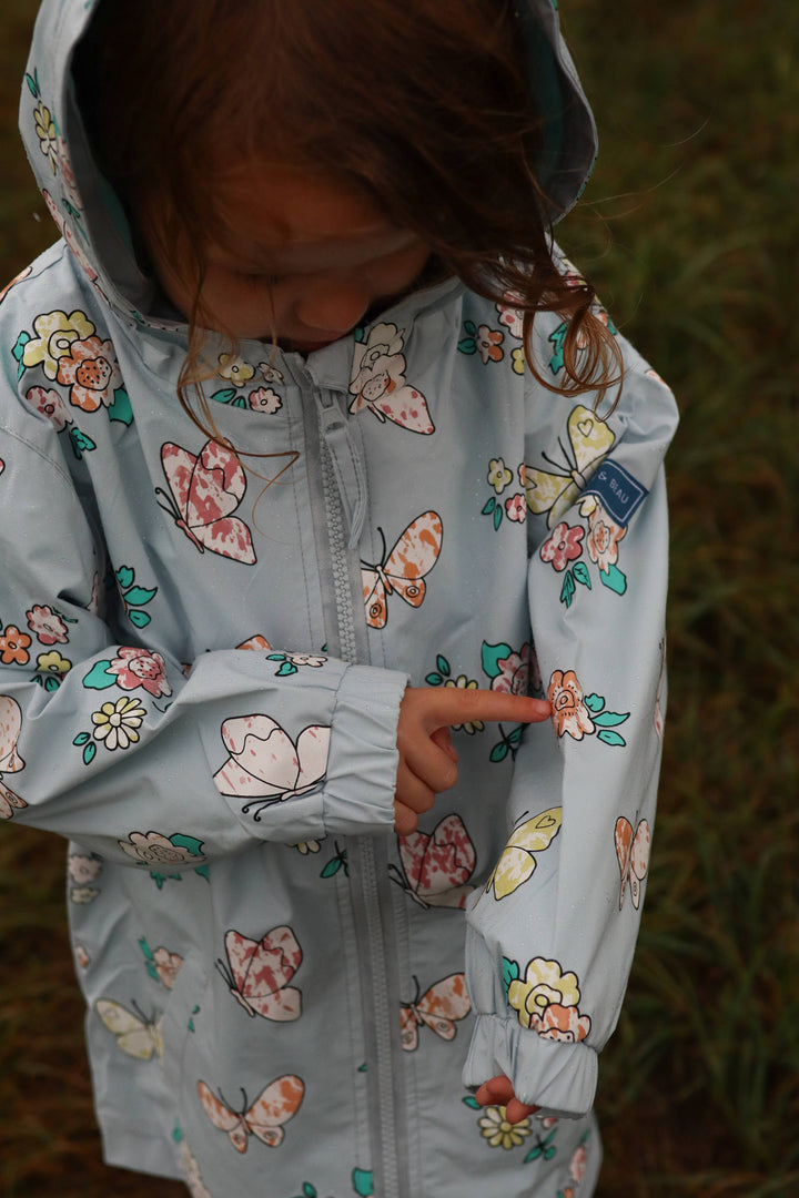 Holly & Beau Flower and Butterfly Color Changing Raincoat model close