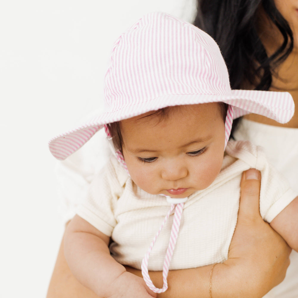 Huggalugs Pink Seersucker Sunhat model
