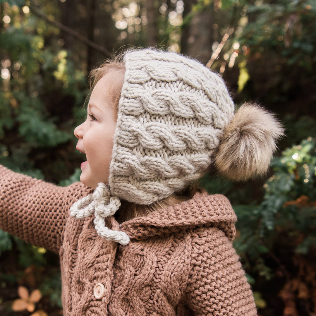 Huggalugs Aspen Oatmeal Cable Knit Bonnet model girl