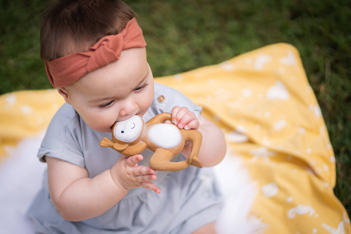 Tikiri Natural  Rubber Monkey Rattle and Teether model girl