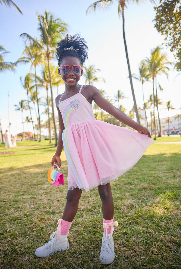 Lola + The Boys Heart Rainbow Tulle Dress model holding skirt