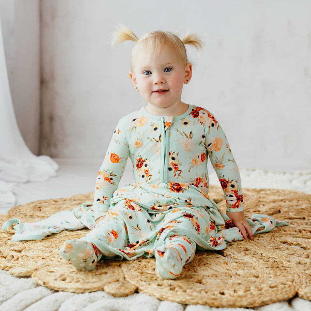 Kickee Pants Fall Floral Ruffle Footie model