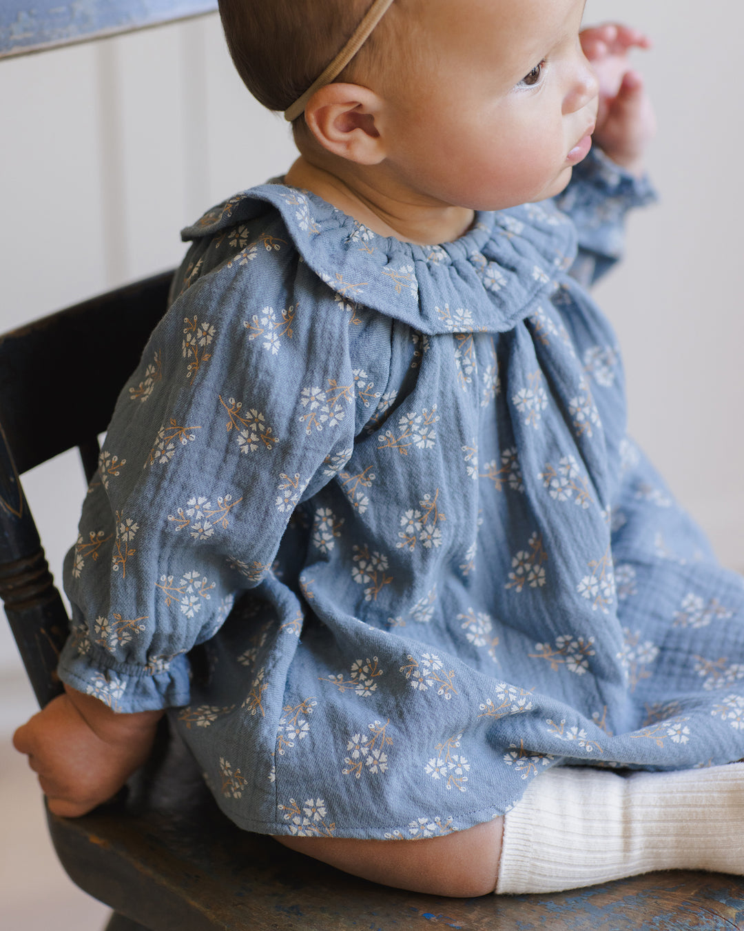 Quincy Mae Blue Floral Isla Baby Dress model close