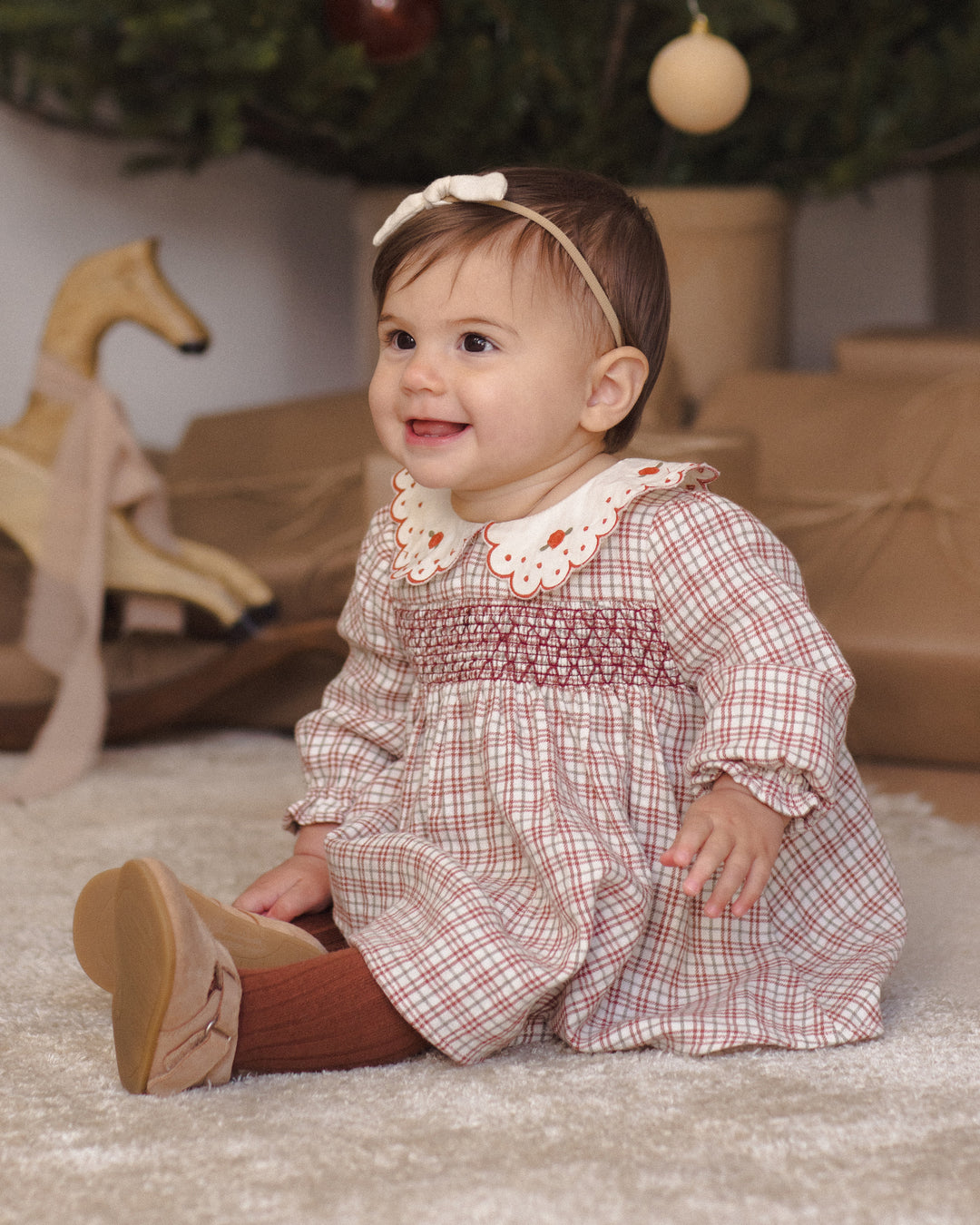 Quincy Mae Callie Christmas Plaid Dress model carpet