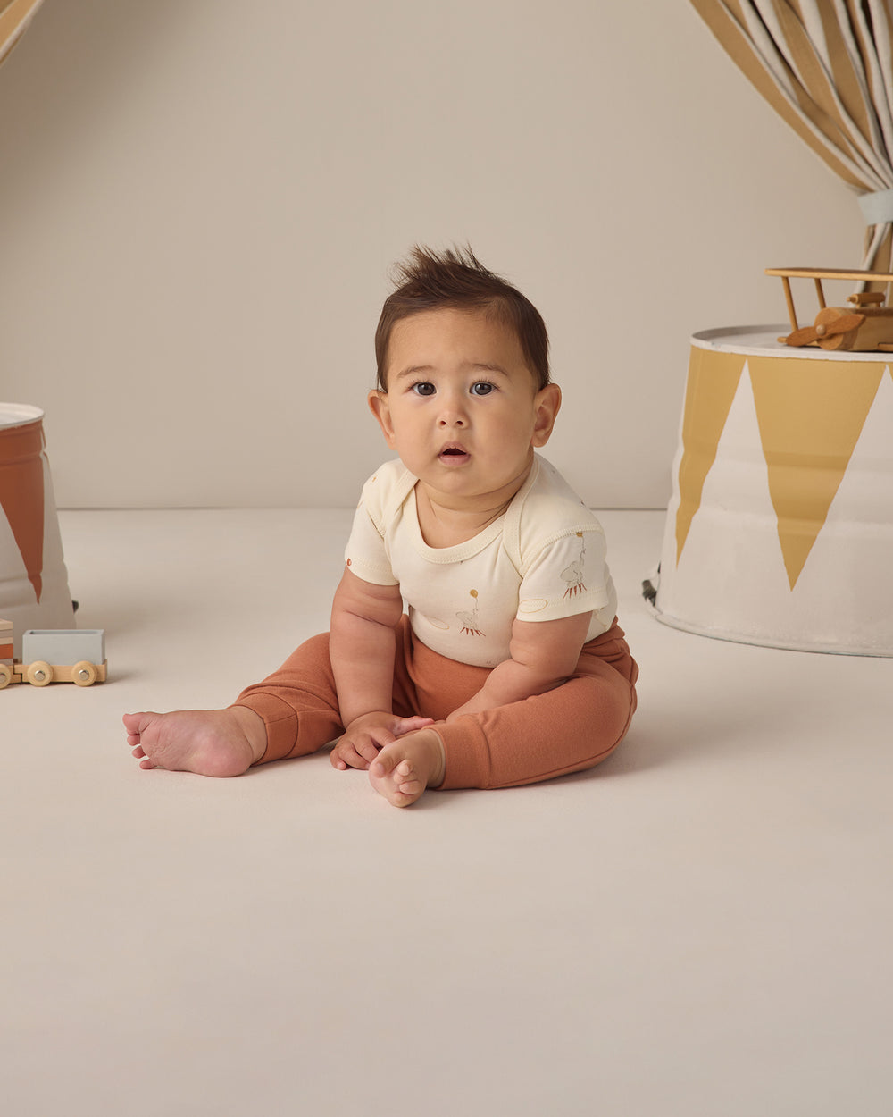 Quincy Mae Poppy Baby Pants model carnival body suit