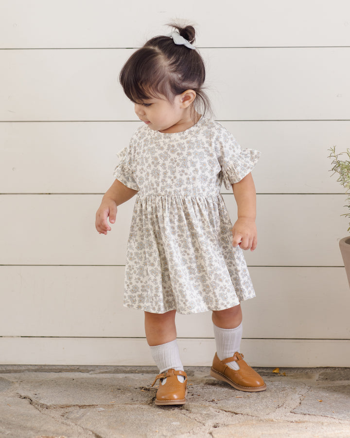 Quincy Mae Blue Floral Bamboo Dress model looking back
