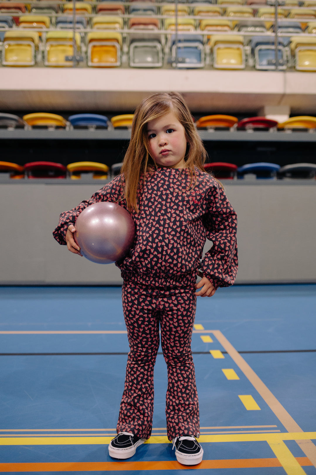 Stains & Stories Hearts All Over Sweatshirt and pants model standing