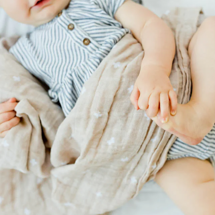 Little Unicorn Taupe Cross Swaddle close up