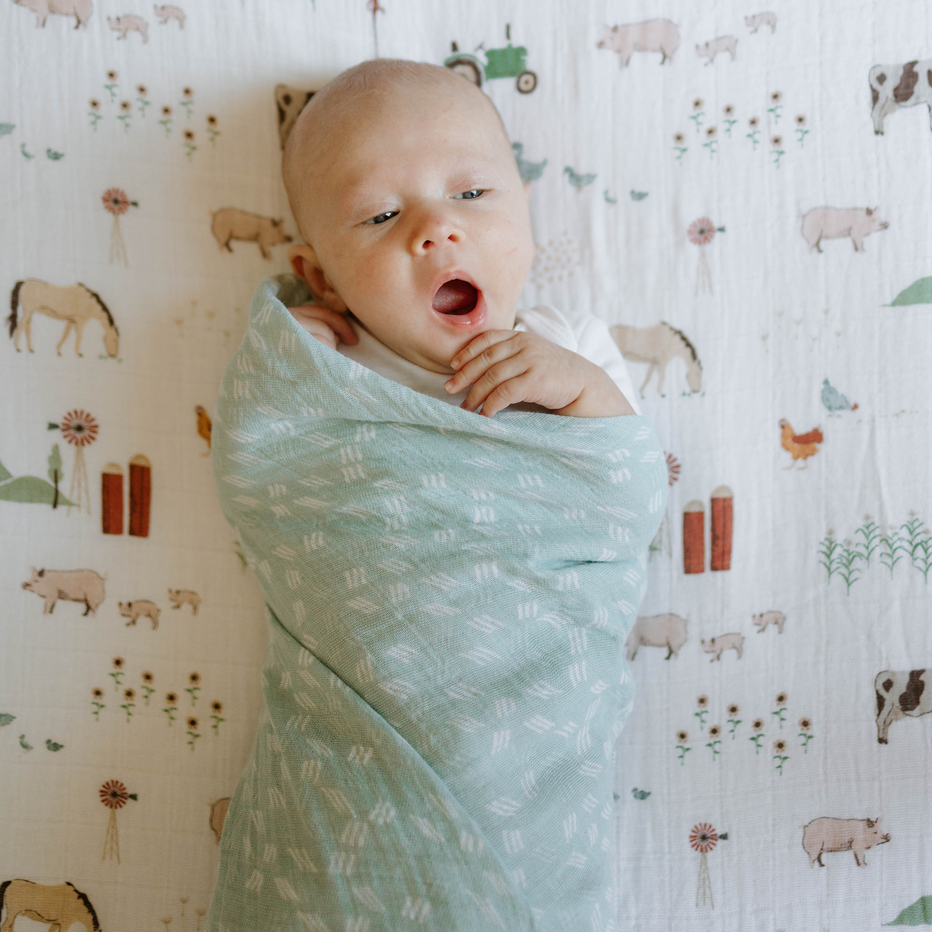 Little Unicorn Misty Field Swaddle model