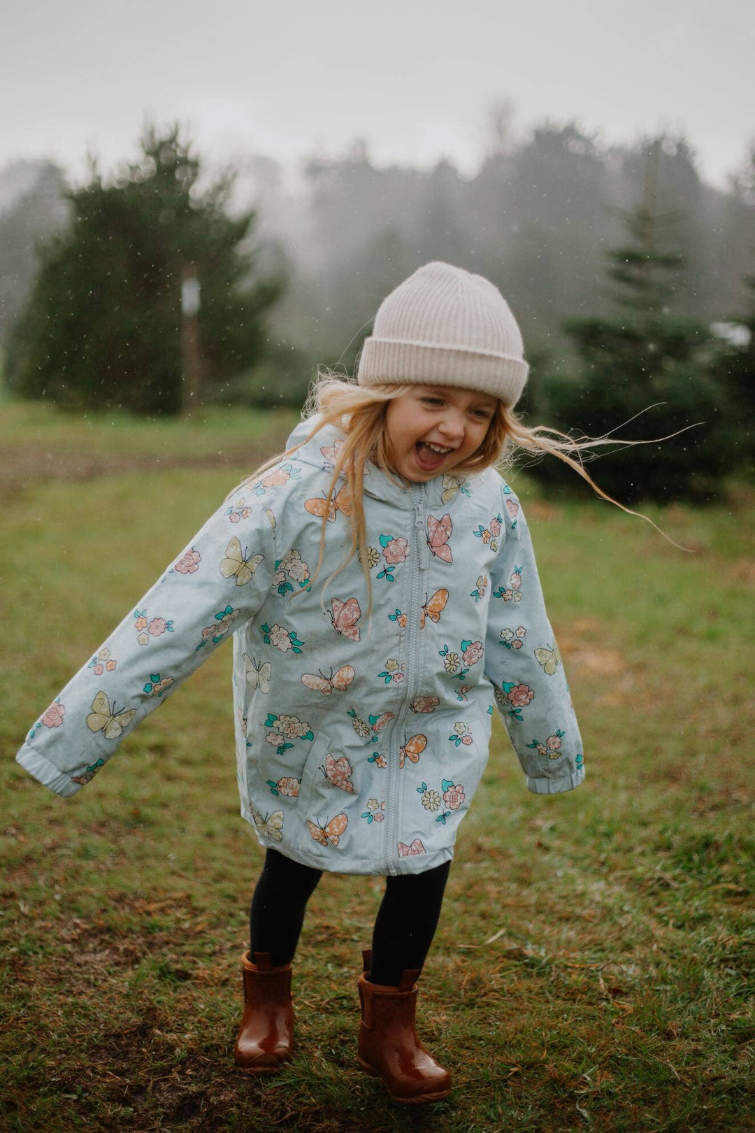 Holly & Beau Flower and Butterfly Color Changing Raincoat model