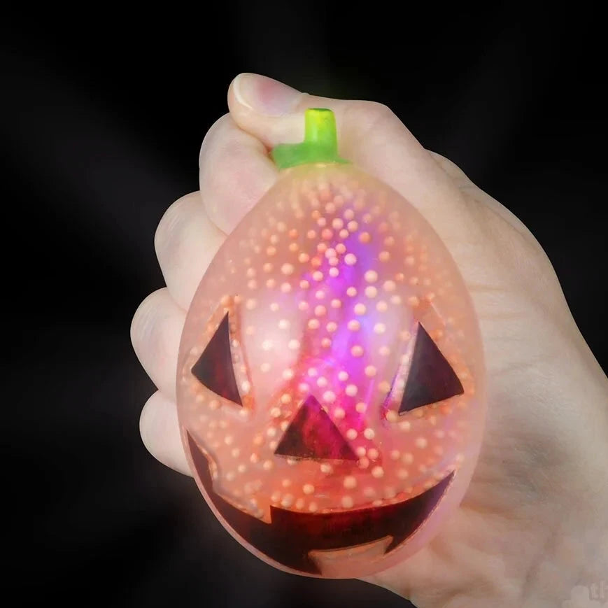 Light-Up Halloween Squish Jack O Lantern squishing