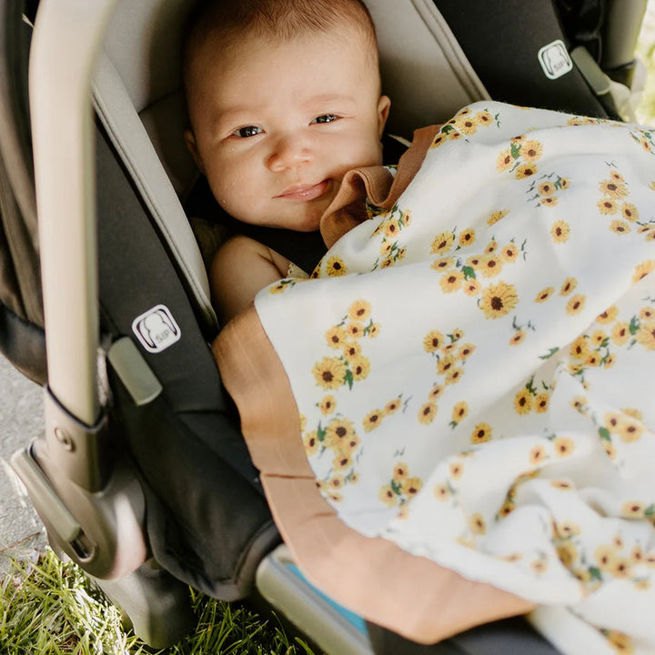 Little Unicorn Ditsy Sunflower Baby Quilt model