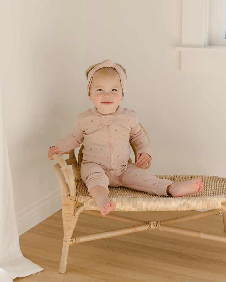 Quincy Mae Cherries Romper model seating