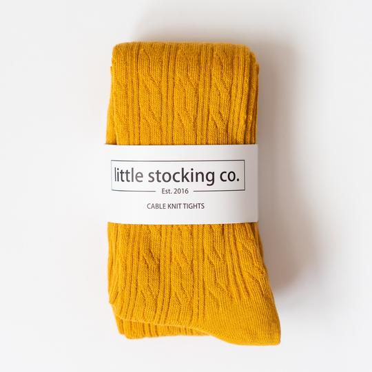 Little Stocking Cable Tights in Marigold package